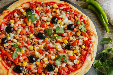 pizza with minced meat tomato cheese corn olives