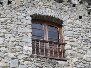 Fototapeta na wymiar Vintage Wooden Window of a Stone Building in Andorra La Vella 