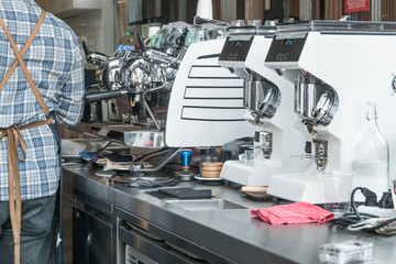 Abstract background atmosphere behind cafe counter, selective focus on coffee machine