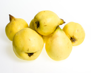 Group of quince fruit on white