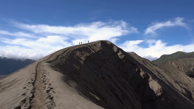 Bromo, Java, Indonesia - 27 JUNE 2016: Tourists walk at active Bromo volcano