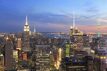 New York City skyline illuminated at dusk, US