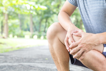 Man having knee pain while exercising, Sport injury concept