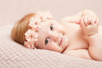 newborn caucasian female smiling. innocence, youth,birth © tiero