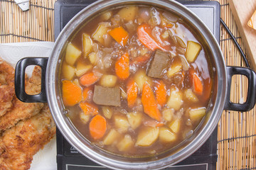 Chef putting Japanese curry pasted for cooking