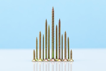 Screw-shaped tree on light blue background