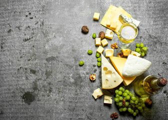 Fototapeta na wymiar Fresh cheese with grapes and white wine.