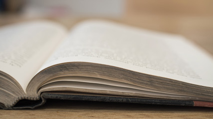 Depth of field Close up open book on wooden table
