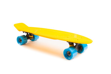 yellow penny skateboard, isolated on white