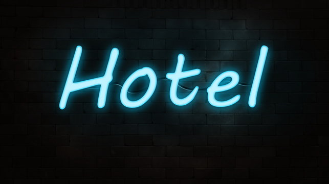 neon sign(Hotel) on brick wall
