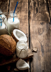 Coconut milk in bottles.