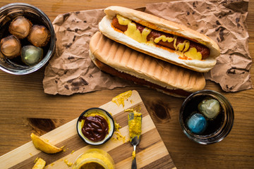 Hot Dog Sandwich with Yellow Mustard and Beverage