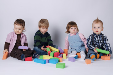 happy children playing with cubes