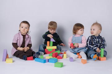 happy children playing with cubes