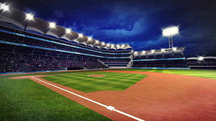 Fototapeta premium illuminated baseball stadium with spectators and green grass