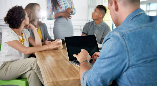 Image Of A Succesful Casual Business Man Using Laptop During Meeting