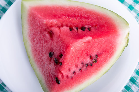 Top view on a large and juicy red slice of watermelon