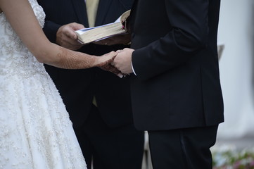 Happy stylish newlyweds in the ortodox church at wedding