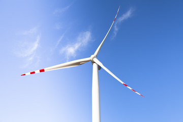 Fototapeta premium Wind Turbine over blue sky