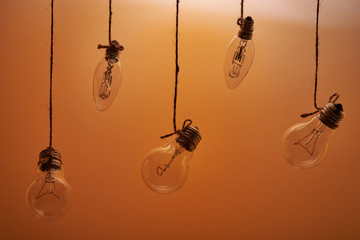 bulbs hanging on an orange background