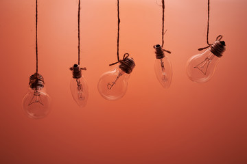 bulbs hanging on laces on a red background