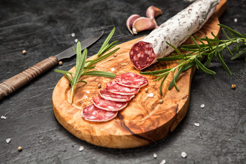 Salami on dark background