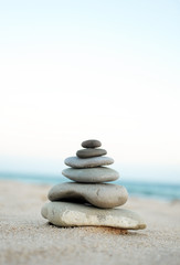Fototapeta na wymiar Zen stones on the sand