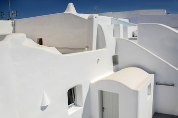 the beautiful white walls of the old Greek houses on the streets in Greece, Santorini