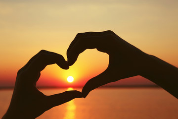Plakat Love sign. Heart symbol against sunset