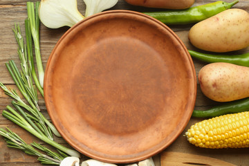 Empty plate with vegetables, closeup