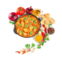 Chicken curry with vegetables on a white background