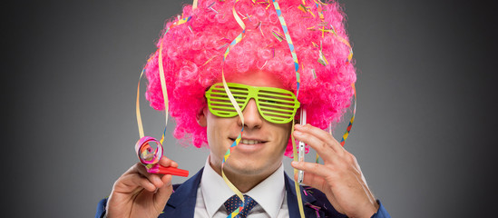 Funny businessman in pink wig