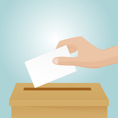 Put a vote paper in the ballot box