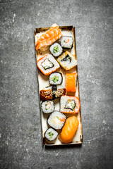 tray of sushi rolls and seafood.