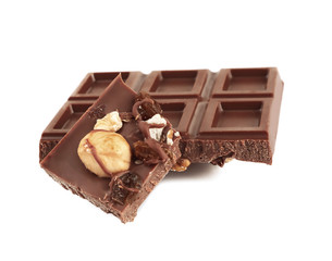 Milk chocolate tiles with nuts isolated on white