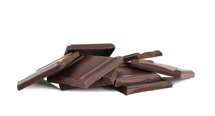 Pile of dark chocolate tiles isolated on white