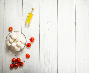 Mozzarella with tomatoes and olive oil.