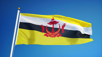 Brunei flag waving against clean blue sky, close up, isolated with clipping mask alpha channel transparency, perfect for film, news, digital composition