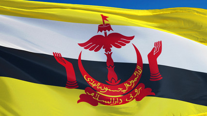 Brunei flag waving against clean blue sky, close up, isolated with clipping mask alpha channel transparency, perfect for film, news, digital composition