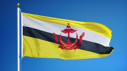 Brunei flag waving against clean blue sky, close up, isolated with clipping mask alpha channel transparency, perfect for film, news, digital composition