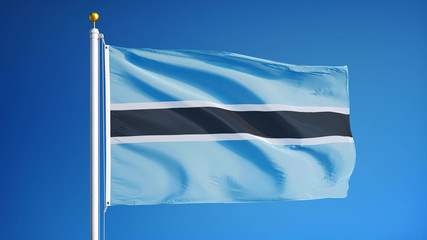 Botswana flag waving against clean blue sky, close up, isolated with clipping mask alpha channel...