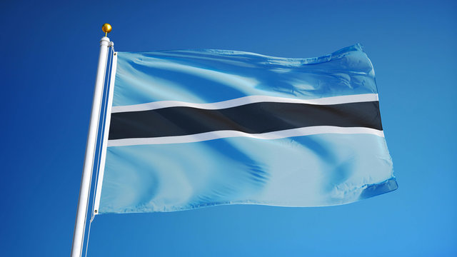 Botswana flag waving against clean blue sky, close up, isolated with clipping mask alpha channel transparency, perfect for film, news, digital composition