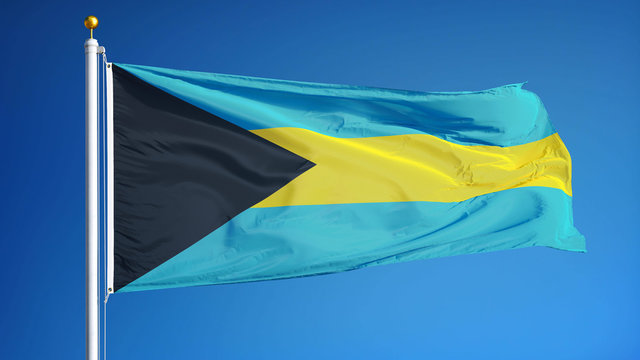 Bahamas flag waving against clean blue sky, close up, isolated with clipping mask alpha channel transparency, perfect for film, news, digital composition
