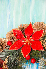 Christmas wreath Greeting Card. Vintage Style. Hanging decoration turquoise shabby table wooden background. Top view, flat lay with copyspace slogan text message.