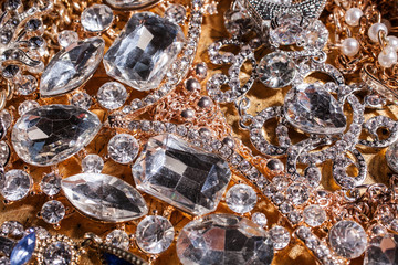 Background of precious golden and silver luxury jewelry.