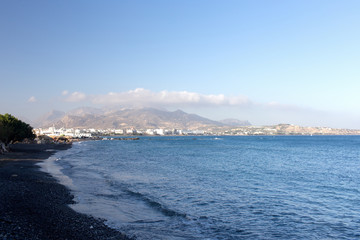 City by the sea surrounded by mountains