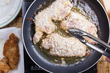 Chef deep fried pork in pan