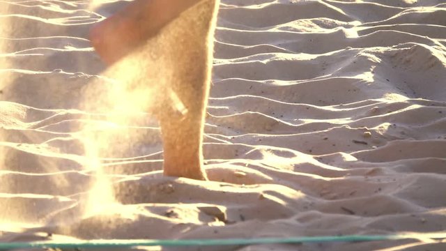 Beach volleyball, men's legs close up, slow motion