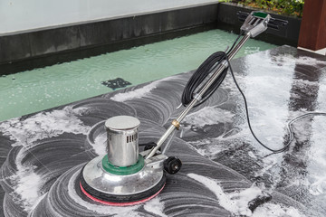 Exterior stone floor cleaning with polishing machine and chemica