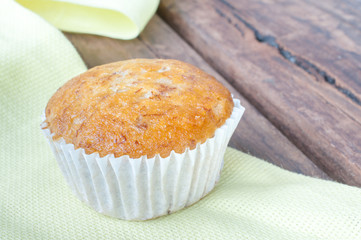 Homemade cupcake banana on the wooden table